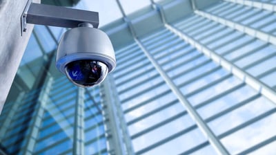 a camera mounted on a pole with a camera attached to it