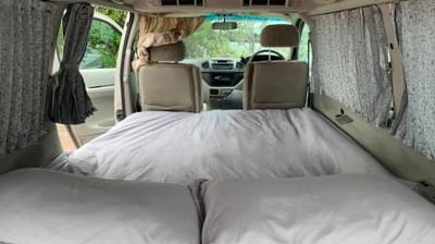 a couple of beds in a explore africa camper