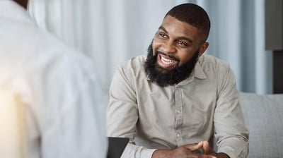 Black man in therapy with a counselor