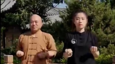 a man and woman doing taido exercises