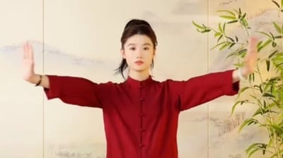 a woman in a red shirt and black pants