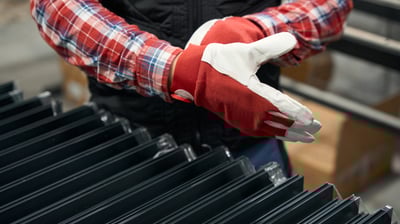 a person wearing gloves and gloves holding a glove