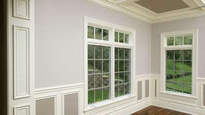 Millwork on windows, boxes on the walls, elegant baseboards and beautiful crown molding.
