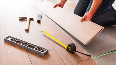 Hardwood floors installer working on new floors