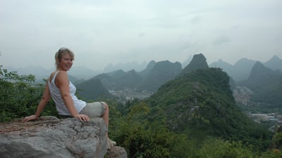 Nick and Tracey Billington climbing the hills above the city of Guilin, China