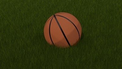 A 3D-rendered basketball resting on vibrant green grass, showcasing realistic textures and lighting.