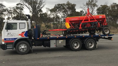 towing agricultural implements using a special hitch tool