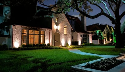 landscape lighting on front facade of house, tree up lighting and moon lighting