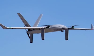 Fixed wing drone flying through the sky