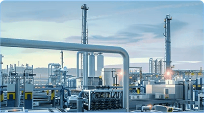 a large industrial steel pipework with a view of a refinery