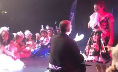 a man in a costume on stage