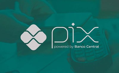 a person holding a cell phone in front of a phone