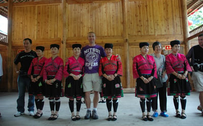 Nick Billington with traditional long haired women at Huangluo Yao Village, China