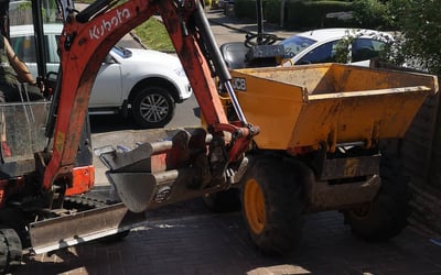 Dumper moving spoil on small site in Dudley
