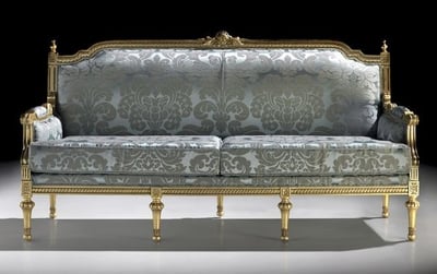a couch with a gold and silver colored couch