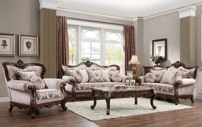 a living room with a couch and chairs