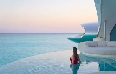 shebara-resort-overwater-villa-pool-sunset-model