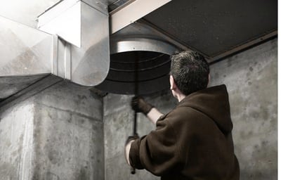 A guy cleaning chute