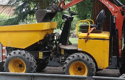Vibrating roller compacting base layer in Stourbridge driveway
