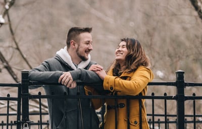 a man and woman standing next to each other