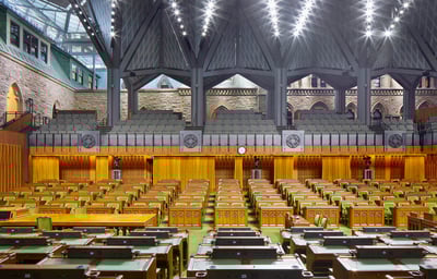 a large room with a lot of wooden tables and chairs