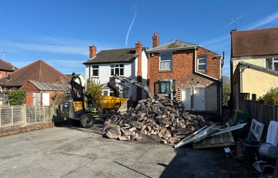 Hydraulic breaker removing concrete in Birmingham