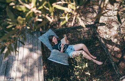 person reading a book on a retreat