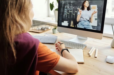 Student attending live online tuition class from home