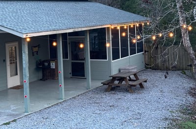 String lights light up the house upon arrival at night. 