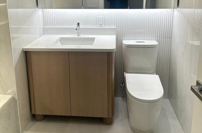 a bathroom with a toilet and a sink