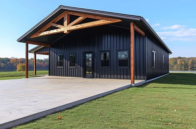 modern cabin with black metal siding barndominium style