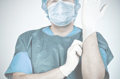 a healthcare gear showcasing by a man in a surgical mask and gloves