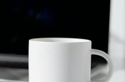 My Happy Place Crafts LLC | Plain, white, ceramic coffee mug next to laptop