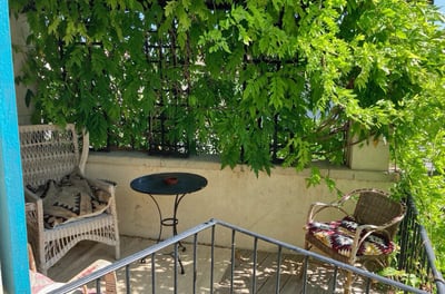 a patio with a table and chairs and a table