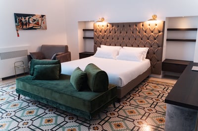 a bed room with a bed and a couch