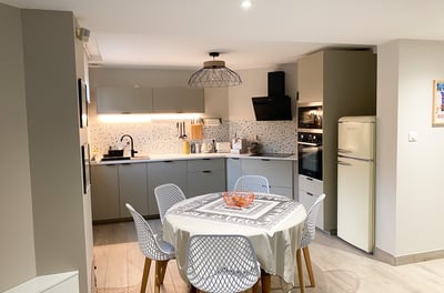 a kitchen table with a table cloth on it