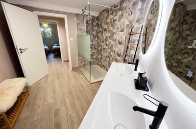 a bathroom with a sink and a mirror