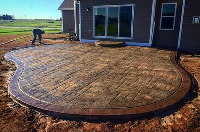 a patio with a brick patio with a brick patio