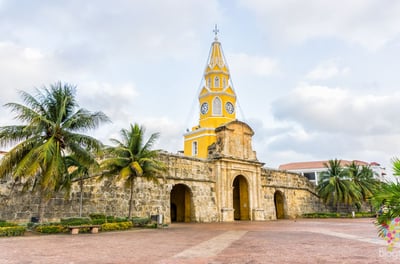 a church with a clock tower in the background