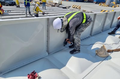 GRP Sectional Water Tank Side Panel Installation from above the Bottom Panel
