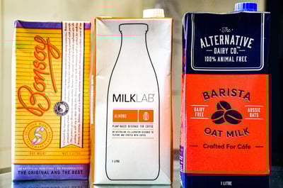Cartons of soy, almond and oat milk in a cafe of Melbourne
