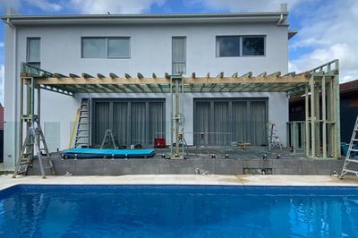 foreground pool with modern home extention in progress