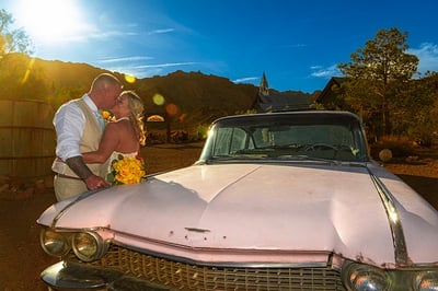 wedding couple by pink cadillac at nelson ghost town