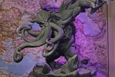 a statue of a dragon with a dragon on it