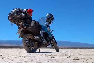 a motorcycle rider's helmet on a desert
