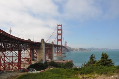 a bridge spanning the golden gate bridge over looking the water