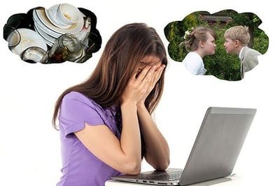 Woman in despair in front of computer surrounded by pics of all the other tasks she has to do