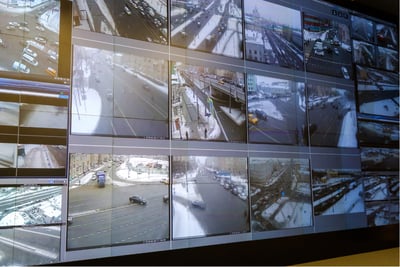 Centralized video wall displaying real-time highway surveillance footage for incident detection and response.