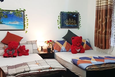 Nuwara Eliya accommodation family room at Nobel Bungalow with double beds and cozy decor