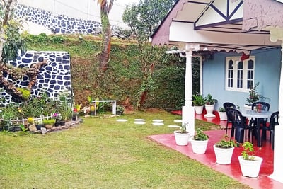 Garden view with outdoor seating at Nobel Bungalow Nuwara Eliya – peaceful holiday space with garden